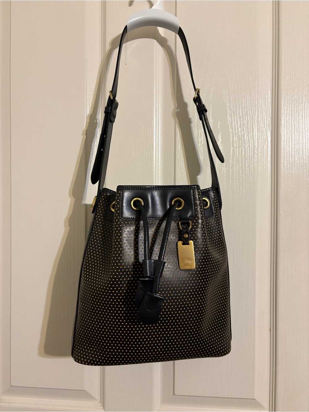 Dooney & Bourke Black Drawstring Shoulder Bag with Gold Tone Accents